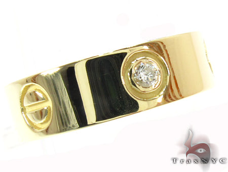 Yellow gold men's engagement ring with single bezel-set diamond and polished finish
