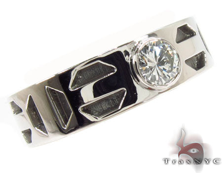Platinum bezel ring with geometric black inlay and round diamond center gemstone