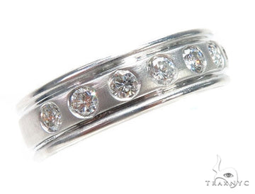 White gold men's wedding band with flush bezel-set round diamonds and polished finish