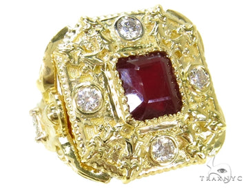 Yellow gold ring with square ruby center and bezel-set diamonds on textured band.