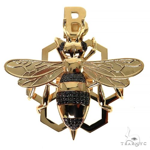 Black diamond bee pendant with round-cut prong-set stones, front-facing view showing full sculpted silhouette