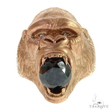 Rose gold gorilla head ring with large black diamond in open mouth detailing.