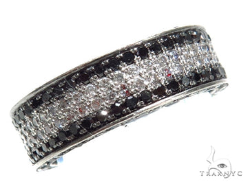 Men's wedding band with alternating rows of black and white round diamonds