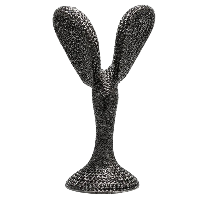 Black diamond-encrusted Spirit of Ecstasy hood ornament with textured silver finish.