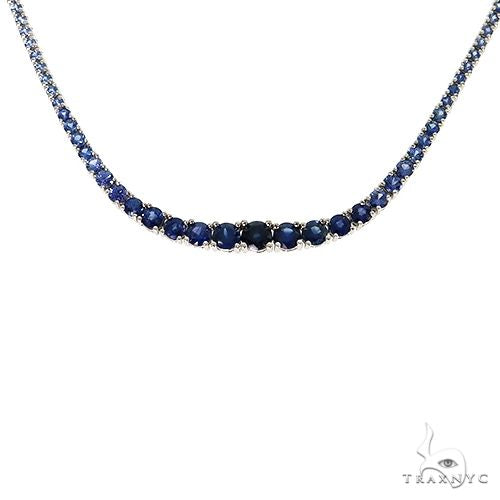 Blue graduated sapphire tennis chain in 14k gold – prong-set round stones tapering from center to clasp, 17 inches