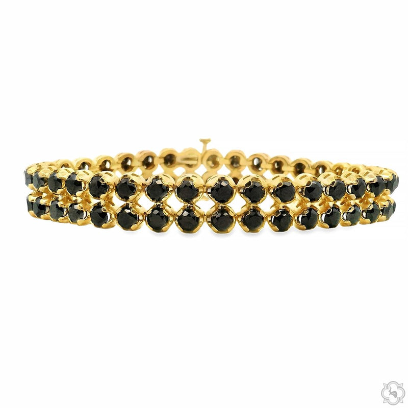 Gold bracelet featuring two rows of round black diamonds in a sleek, elegant design