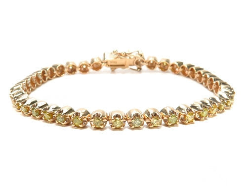 Canary diamond bracelet in 18k yellow gold – round yellow diamonds set across full length, top view
