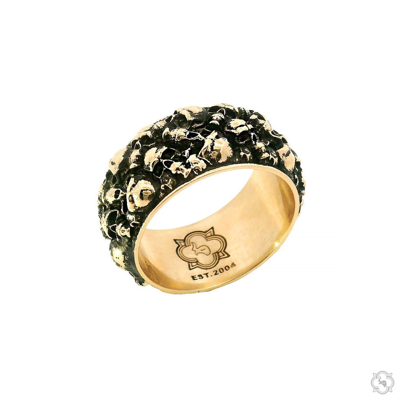 Yellow gold men's band ring with detailed skull designs engraved all around