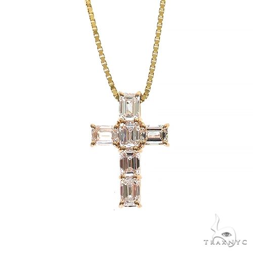 Yellow gold cross pendant with emerald-cut diamonds on a delicate box chain