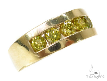Yellow gold men's wedding band with five channel-set yellow diamonds.