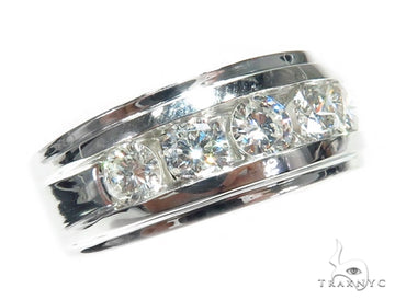 White gold channel setting wedding band with five round-cut diamonds.