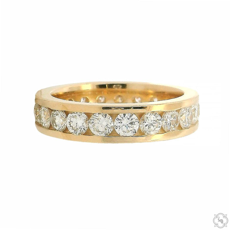 Yellow gold channel set diamond eternity band with round brilliant diamonds