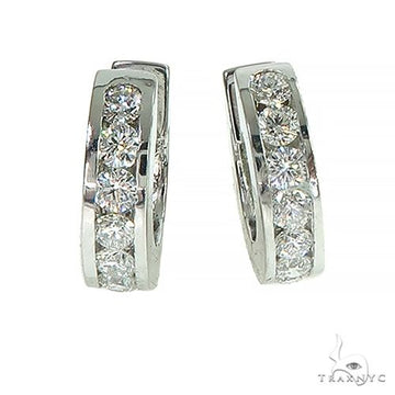 Channel setting diamond huggie hoop earrings in 14k gold – front-facing view showing continuous diamond channel track