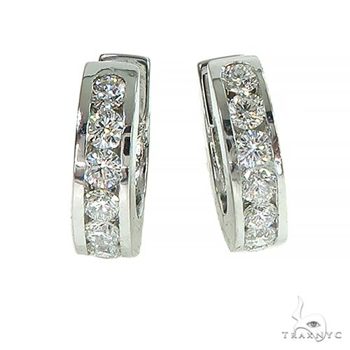 Channel setting diamond huggie hoop earrings in 14k gold – front-facing view showing continuous diamond channel track