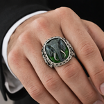 Silver ring featuring a black enamel elephant head with black diamond eyes and textured band.