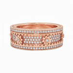 Rose gold mechanical spinner ring with rows of diamonds and gear-inspired design elements.