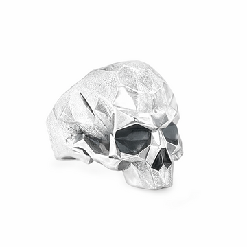 Sterling silver ring featuring a faceted skull design with angular, geometric surfaces across the head
