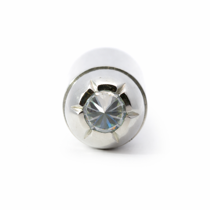 Silver bullet pendant with diamond tip and polished finish, men's stylish jewelry accessory.