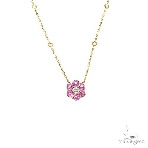 Yellow gold necklace with pink sapphire flower and central diamond gemstone pendant