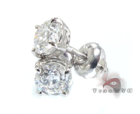 White gold diamond stud earrings with round VS1 clarity diamonds in classic setting.