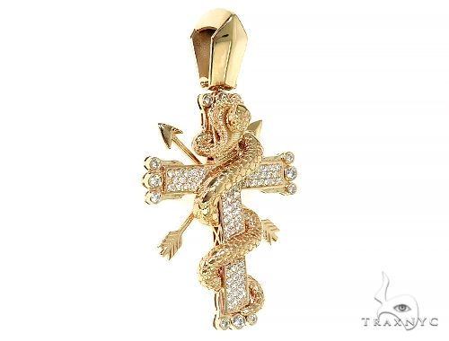 Yellow gold cross pendant with diamond accents wrapped by a detailed cobra design