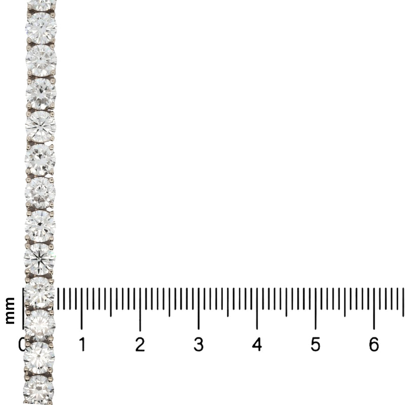 White gold tennis chain with round 75 pointer diamonds, sleek luxury men's jewelry.