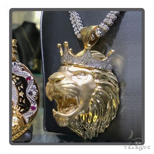 Large yellow gold lion head pendant with diamond crown on diamond chain necklace