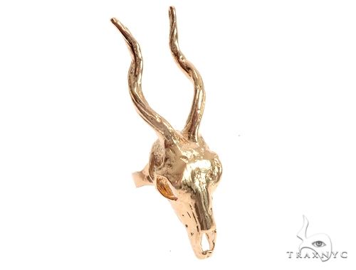 Mens custom 14K yellow gold antelope skull ring – detailed skull face motif, top-down angle