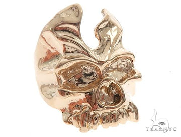 14K yellow gold skull ring with sapphire gemstone accents – front-facing detail view