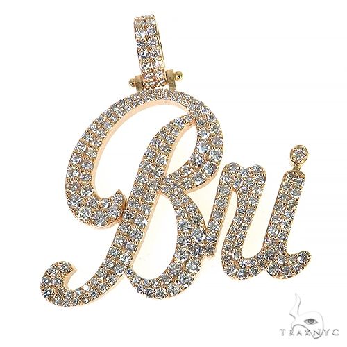 Custom name diamond pendant in gold-tone setting – front-facing view of lettered diamond silhouette