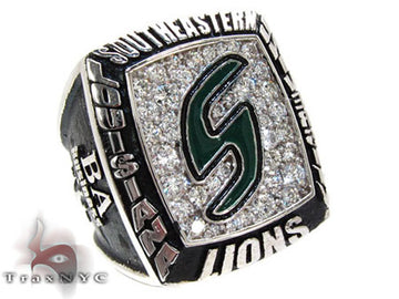 Yellow gold custom class ring with diamond-encrusted face and green emblem center.