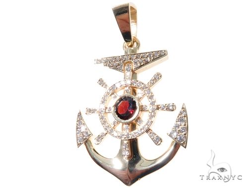 Yellow gold diamond anchor pendant with red gemstone center and pave diamond accents