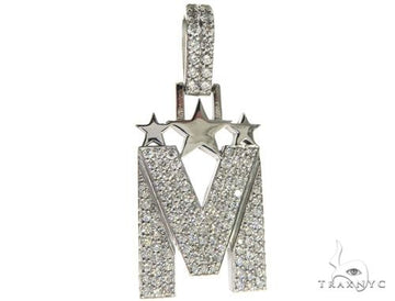 White gold initial M pendant adorned with diamonds and star accents.