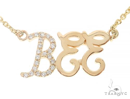 Custom diamond name pendant in yellow gold – small silhouette with round-cut diamond-set letters, front view