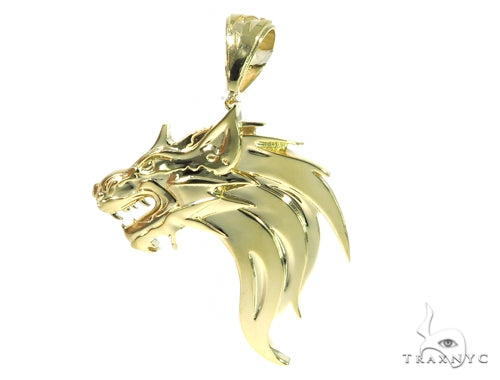 Yellow gold pendant shaped like a fierce firewolf head with sharp detailing and polished finish