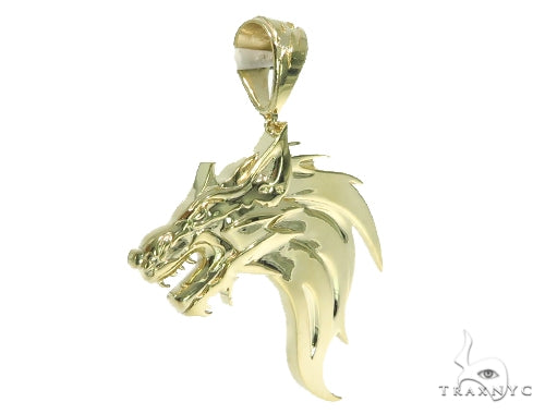 Yellow gold pendant shaped like a fierce firewolf head with sharp detailing and polished finish.