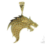 Yellow gold pendant shaped like a fierce firewolf head with sharp detailing and polished finish.