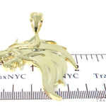 Yellow gold pendant shaped like a fierce firewolf head with sharp detailing and polished finish.