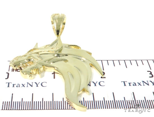 Yellow gold pendant shaped like a fierce firewolf head with sharp detailing and polished finish.