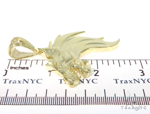 Yellow gold pendant shaped like a fierce firewolf head with sharp detailing and polished finish.