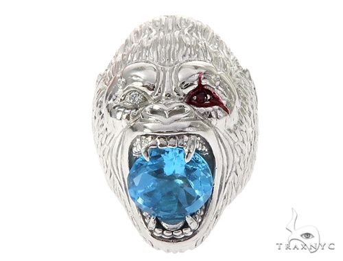 14K white gold gorilla pinky ring with detailed fur texture and large blue gemstone in mouth
