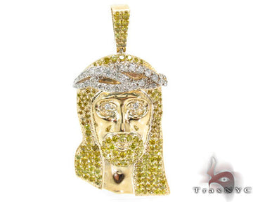Yellow gold Jesus pendant with diamond crown and diamond accents on beard and hair.