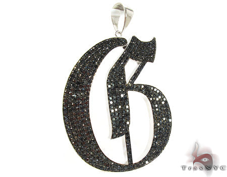 Black diamond encrusted initial G pendant in silver-tone metal with polished bail