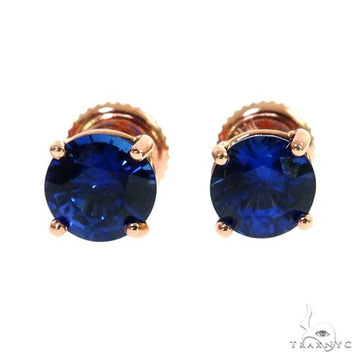 18K rose gold stud earrings with deep blue round sapphire gemstones.