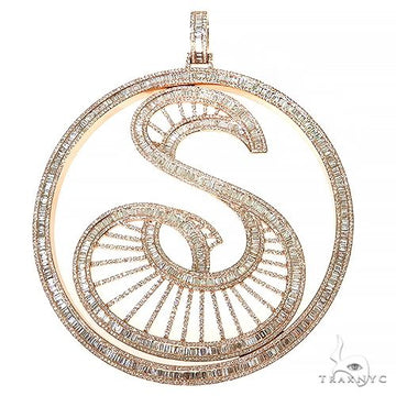 Rose gold baguette diamond initial S pendant with intricate radiant design.
