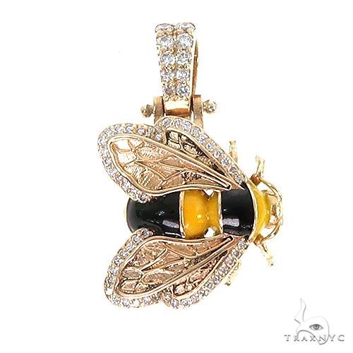 Yellow and black bee pendant with diamond-studded gold wings and bail
