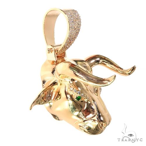Yellow gold custom bull head pendant with detailed horns and textured bail