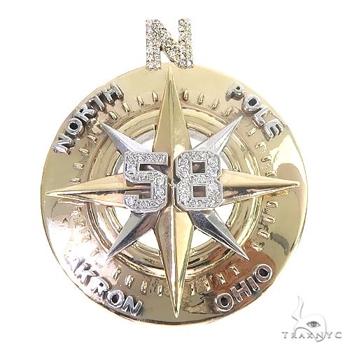 Custom diamond compass pendant in 14k gold with round cut diamond setting, front-facing angle