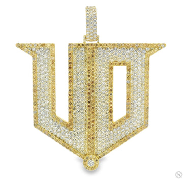 Yellow gold diamond initial pendant with pave-set stones, bold geometric design.
