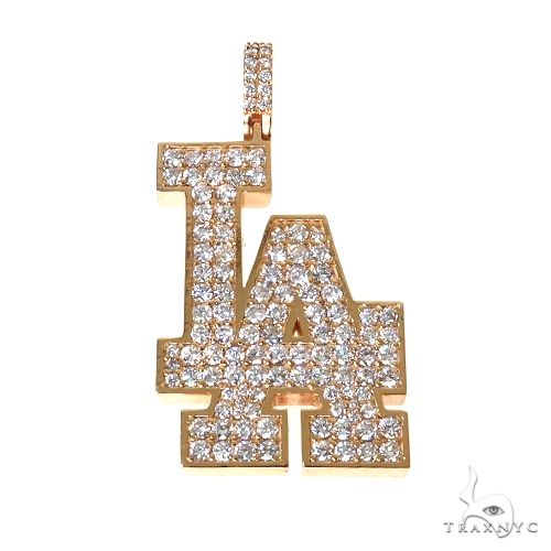 Custom diamond 'LA' initial pendant in yellow gold – round-cut diamonds set across letter face, front angle